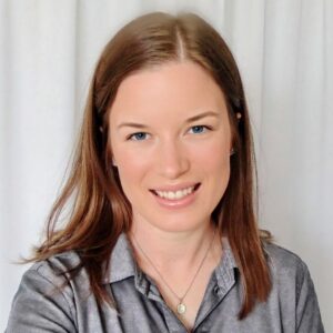 Professional profile photo: White woman, mid length brown hair, button up shirt